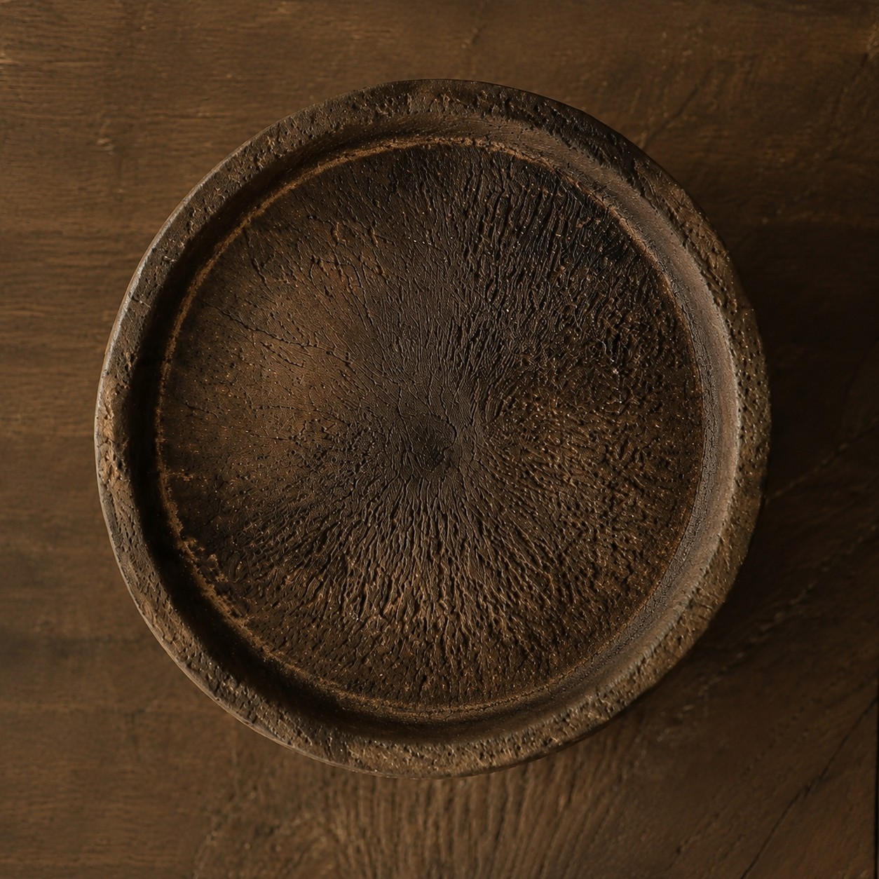 Close view of the candle holder top tray and visible wood grain