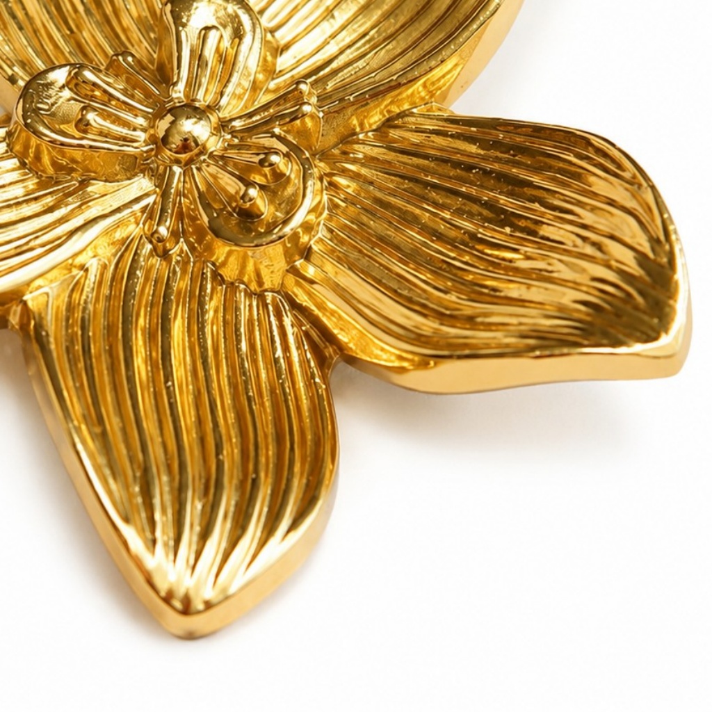 Close view of the ridged petals on a brass flower
