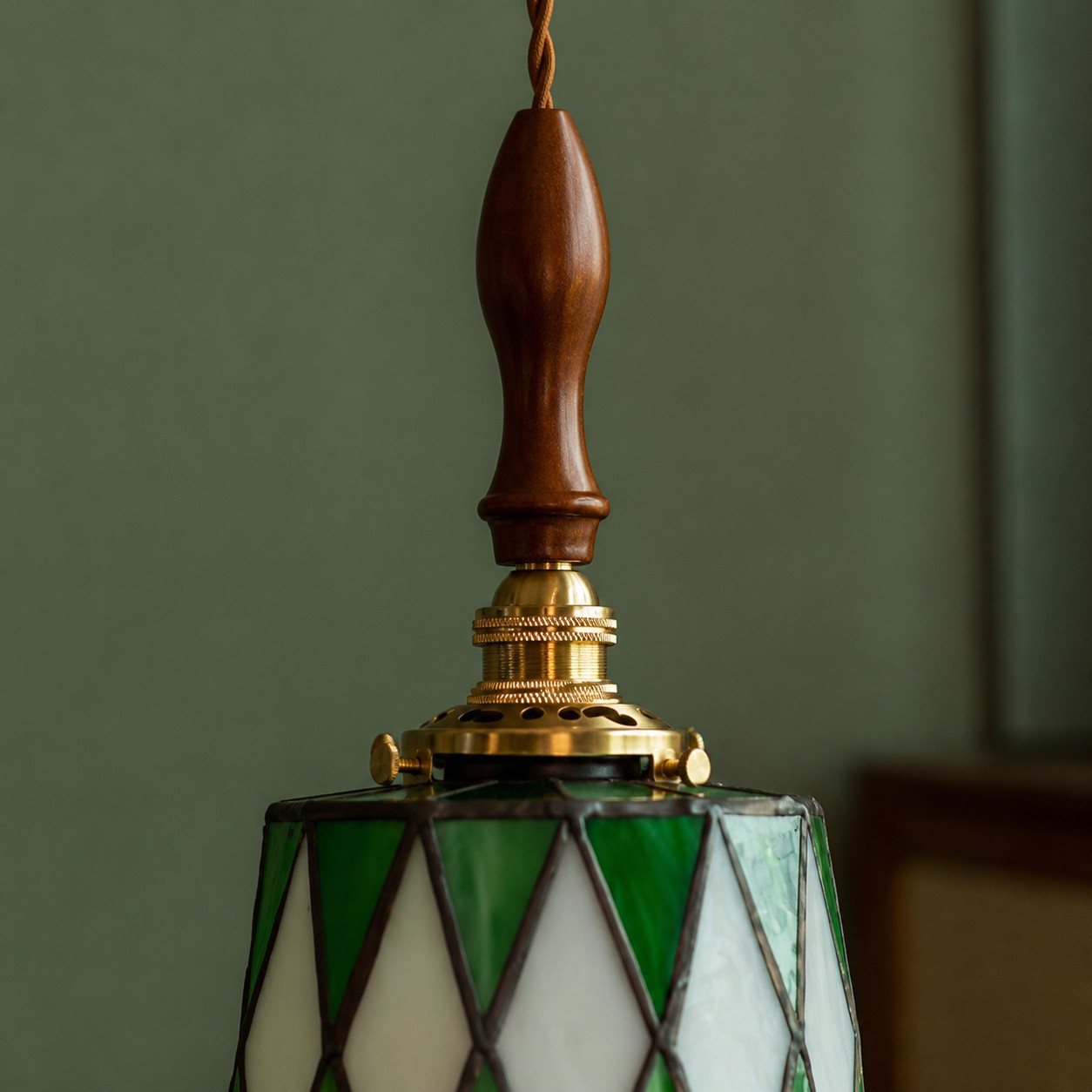 Green and white diamond-pattern glass detail