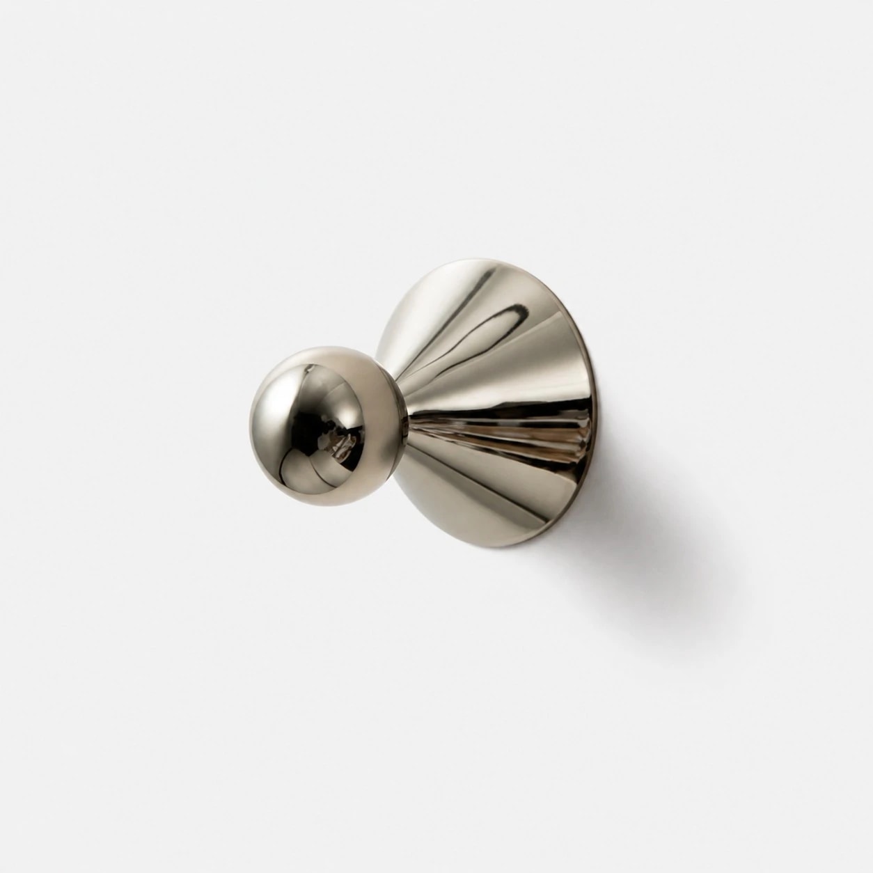 Single polished silver-tone brass cabinet knob