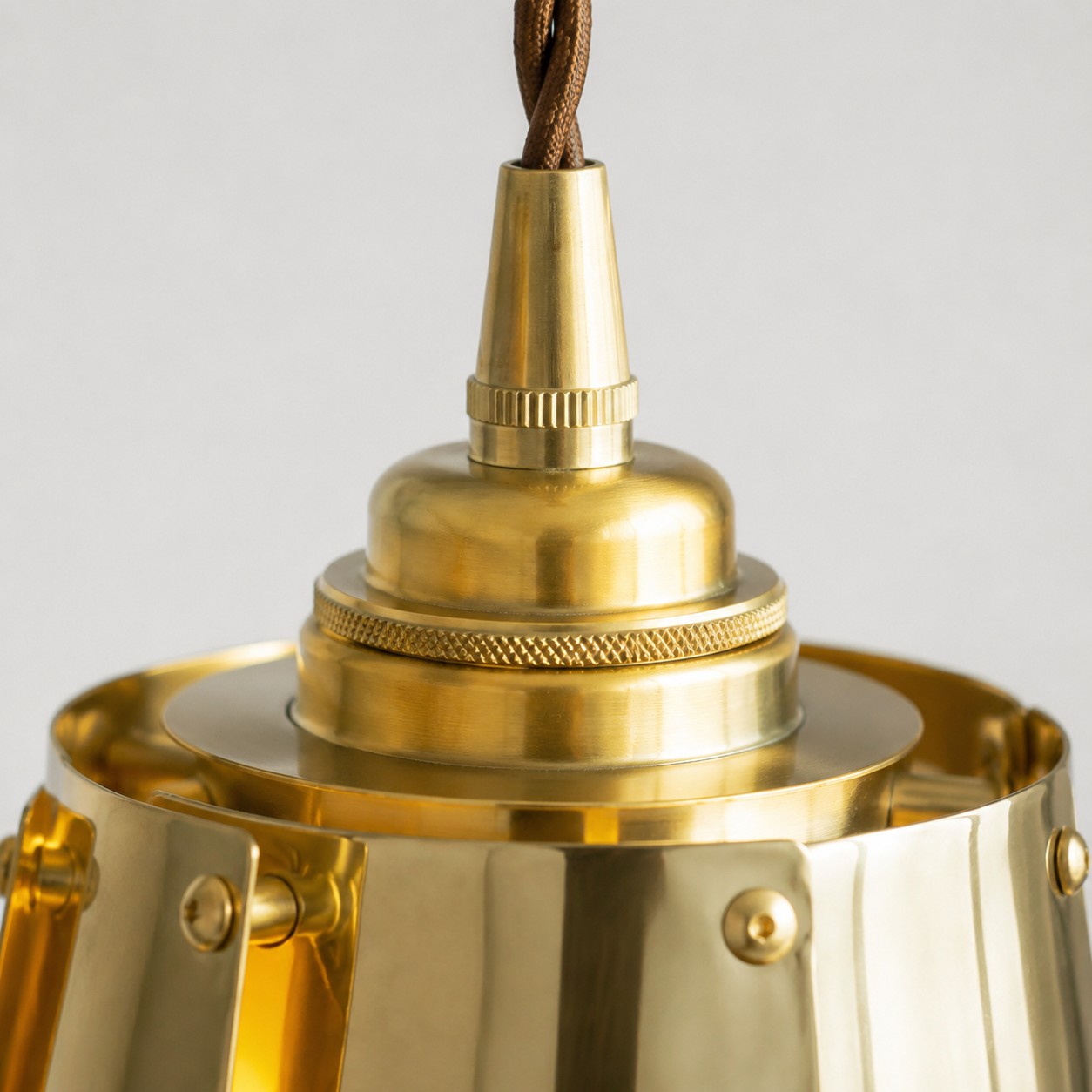 Pendant cord and brass hardware detail
