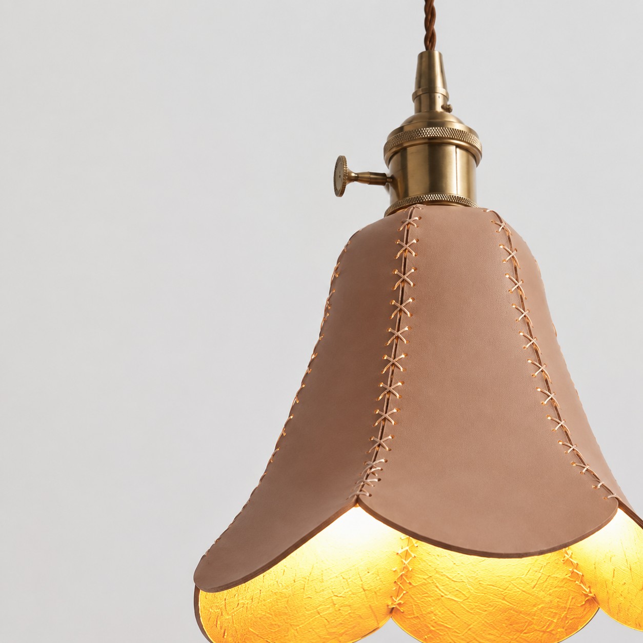Hand-stitched shade construction