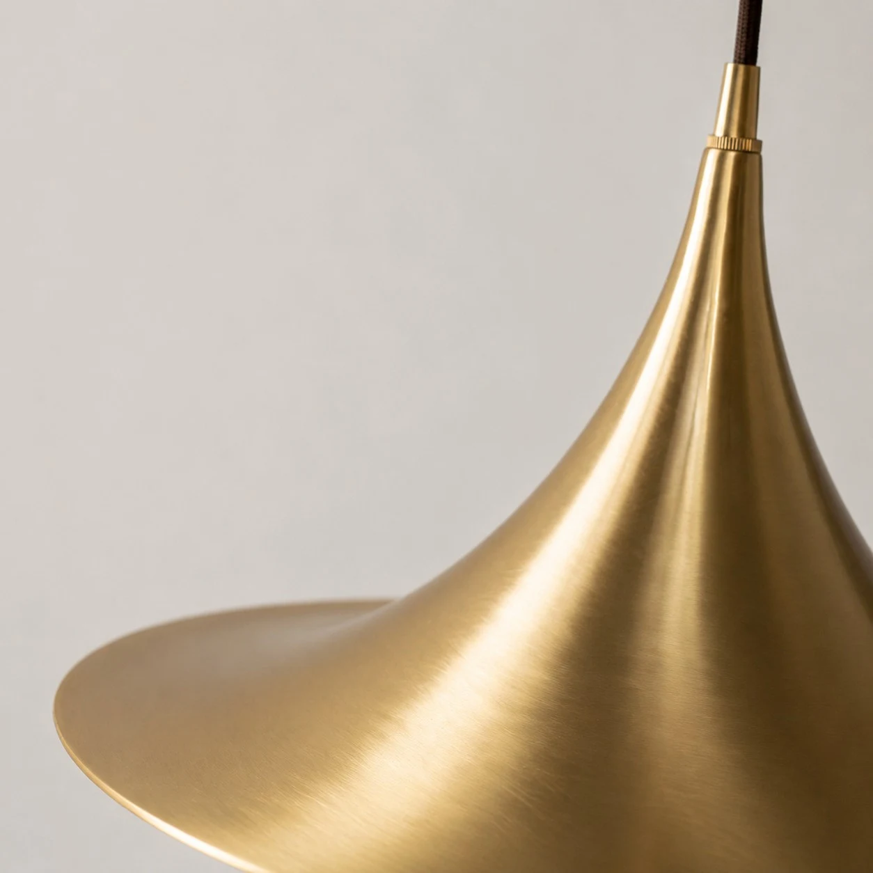 Profile detail of the curved brass shade