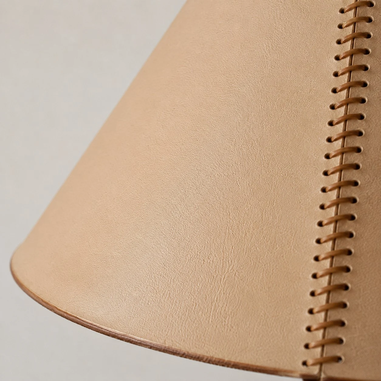 Close view of stitched leather-look shade detail