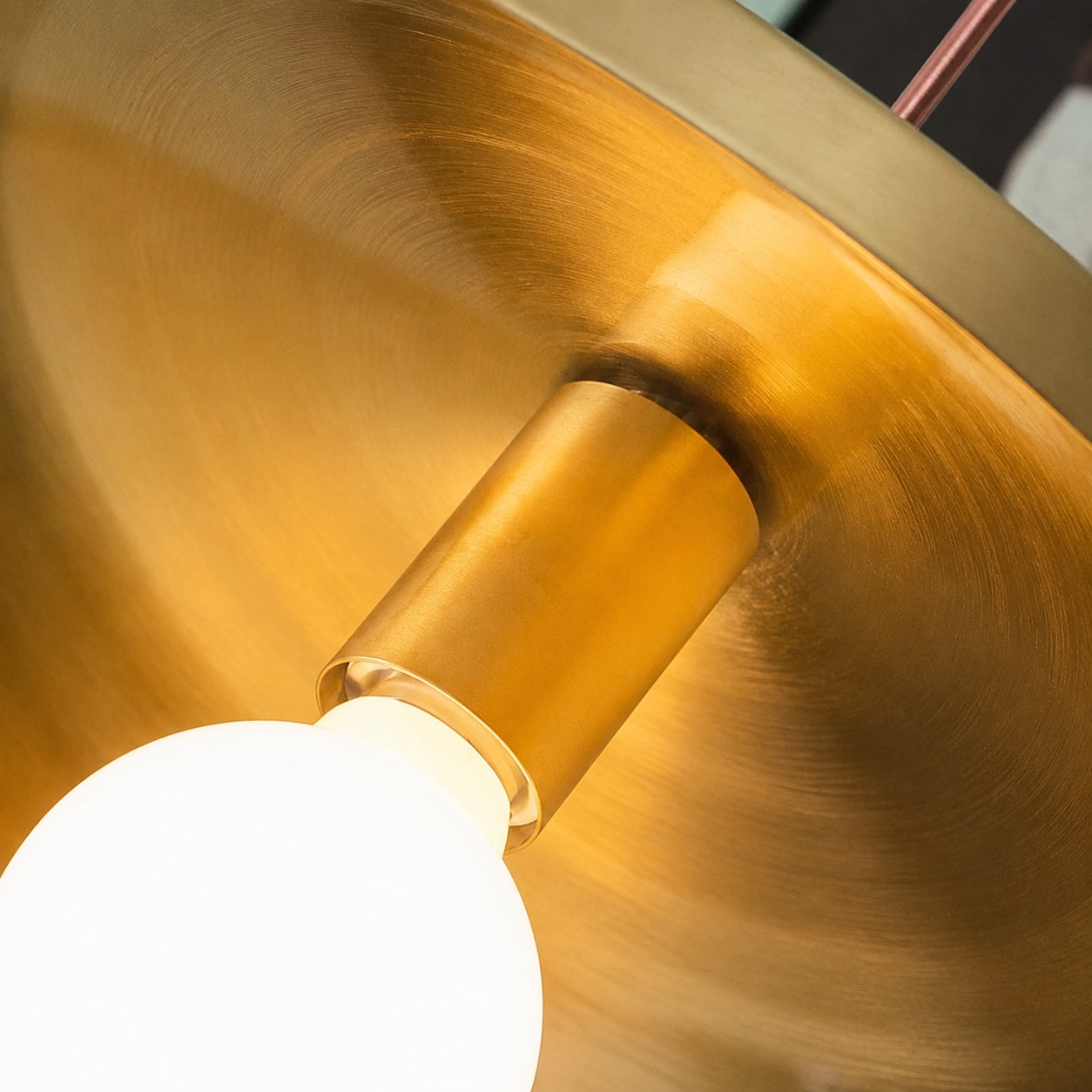 Brushed brass pendant underside and lamp holder detail