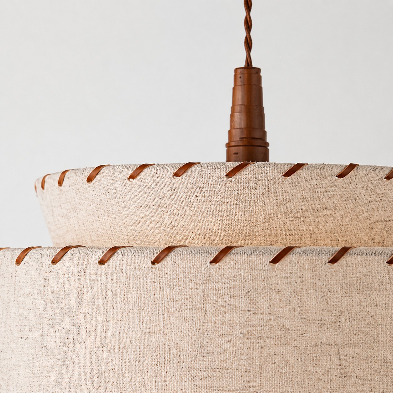 Wood look suspension detail on linen pendant light