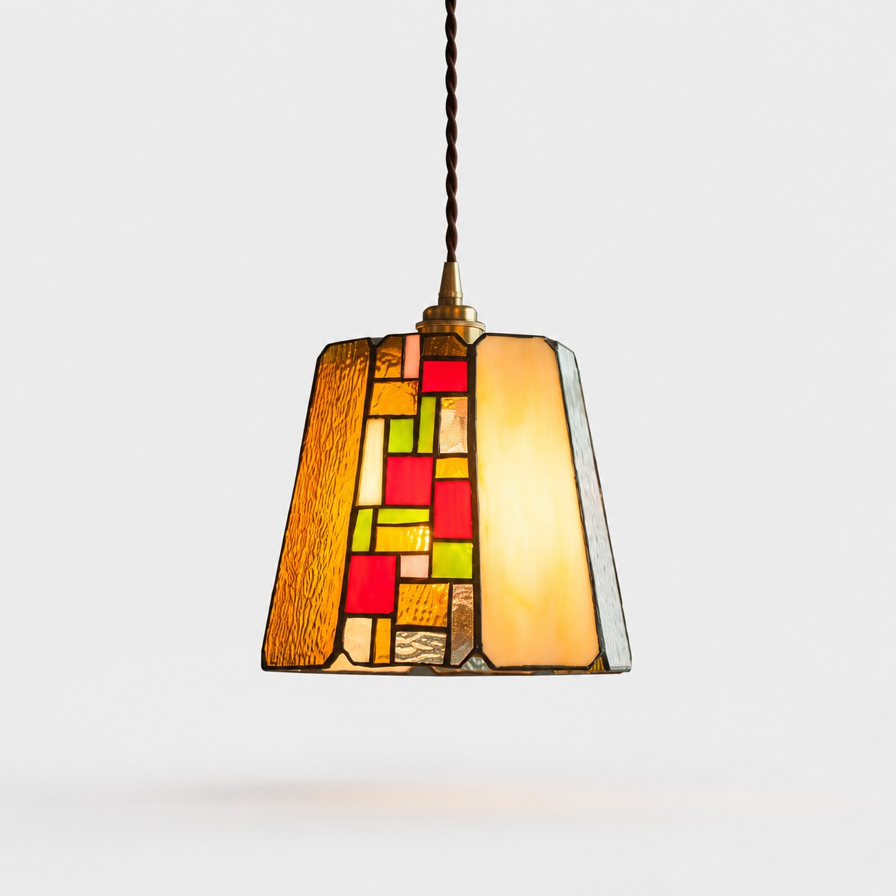 Rose stained glass pendant on a light gray background