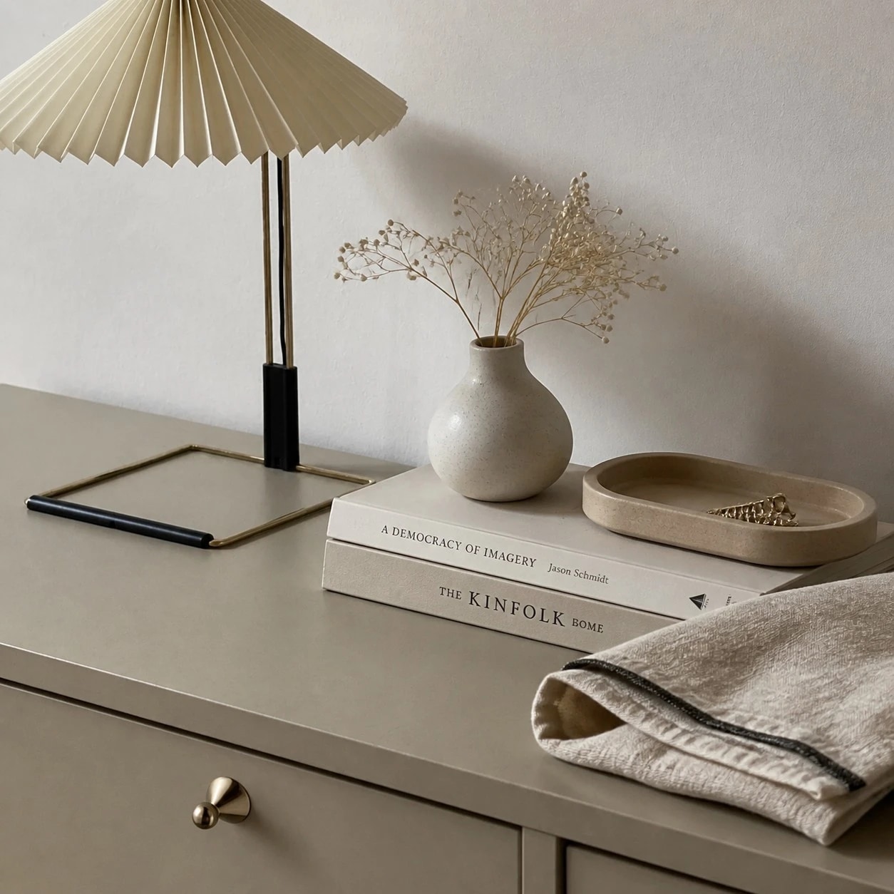 Sculptural cabinet knob installed on a neutral bedroom dresser