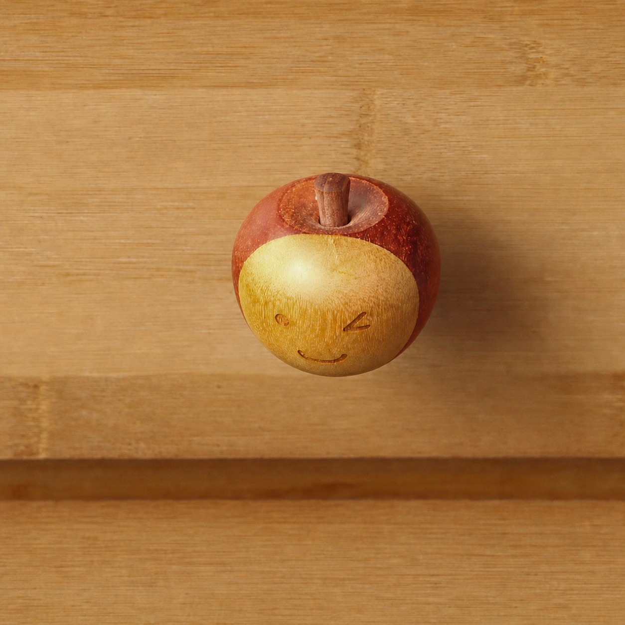 Close-up of red orange wooden cabinet hardware