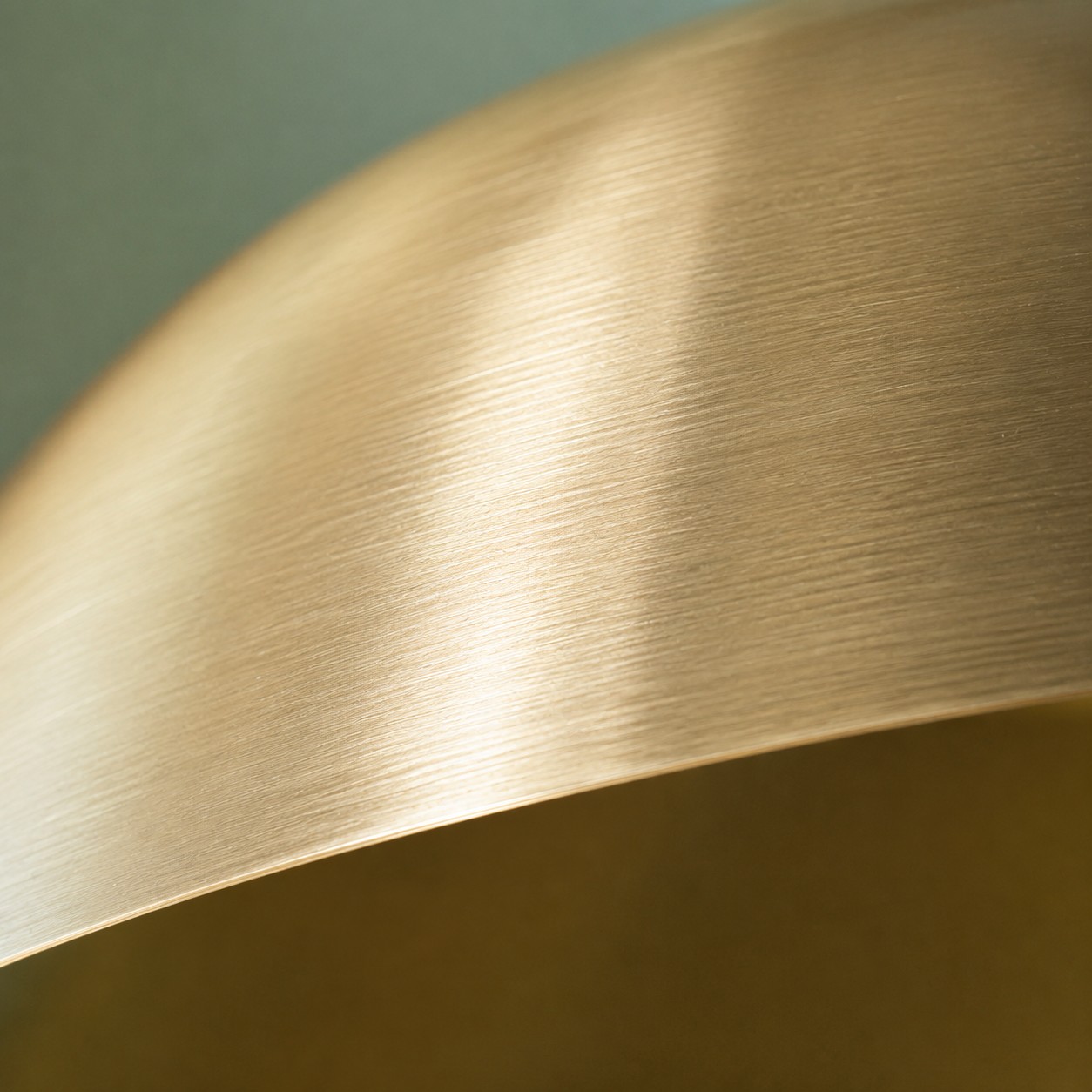 Close view of the brushed brass dome surface