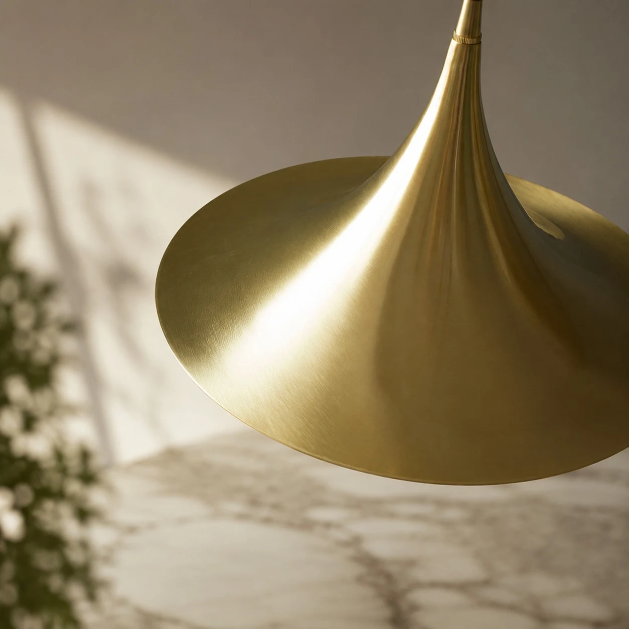 Close view of the brushed brass pendant shade