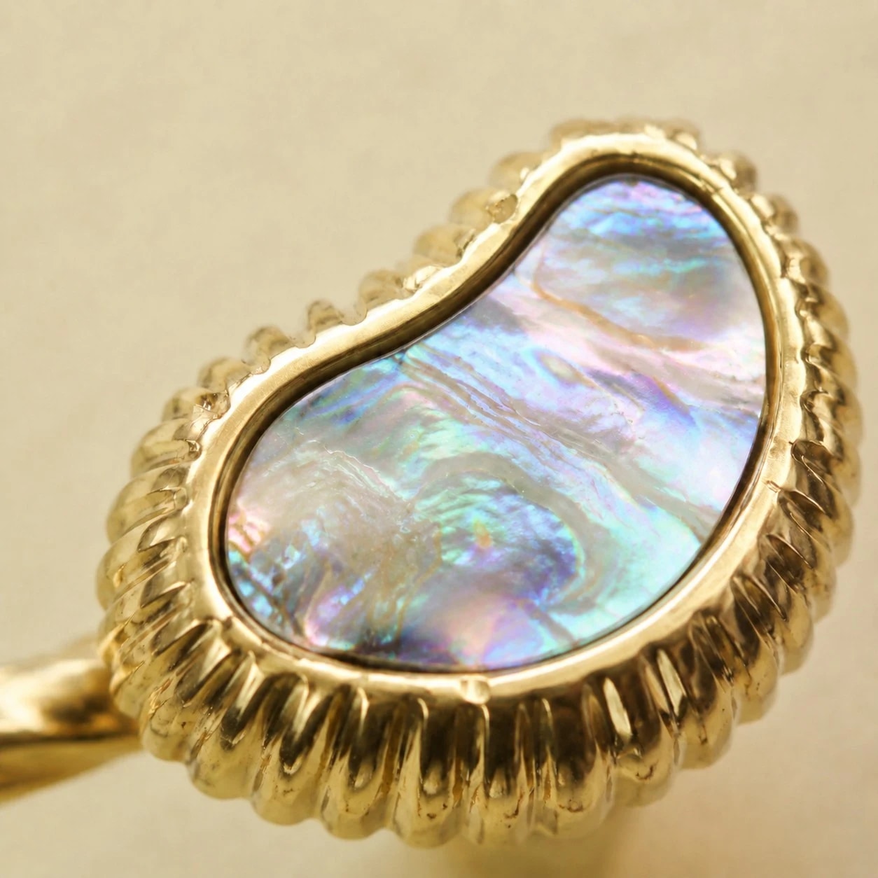 Natural shell inlay and polished brass edge detail