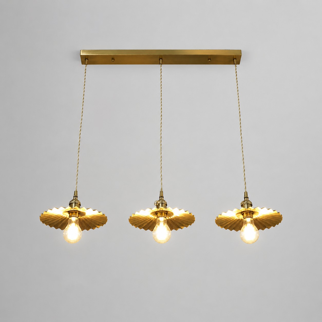 Three-light brass linear pendant fixture