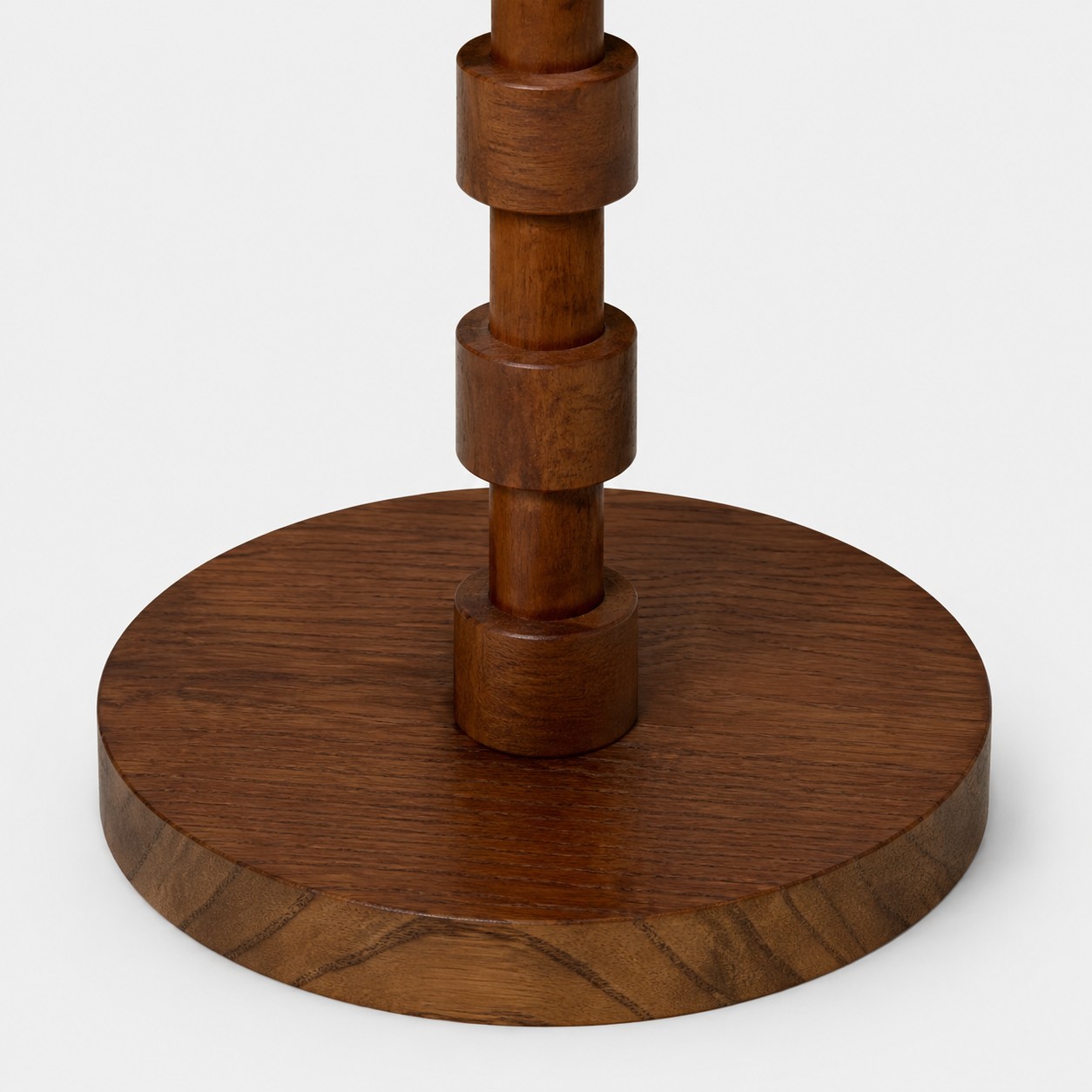 Turned wood column and round wood floor lamp base detail