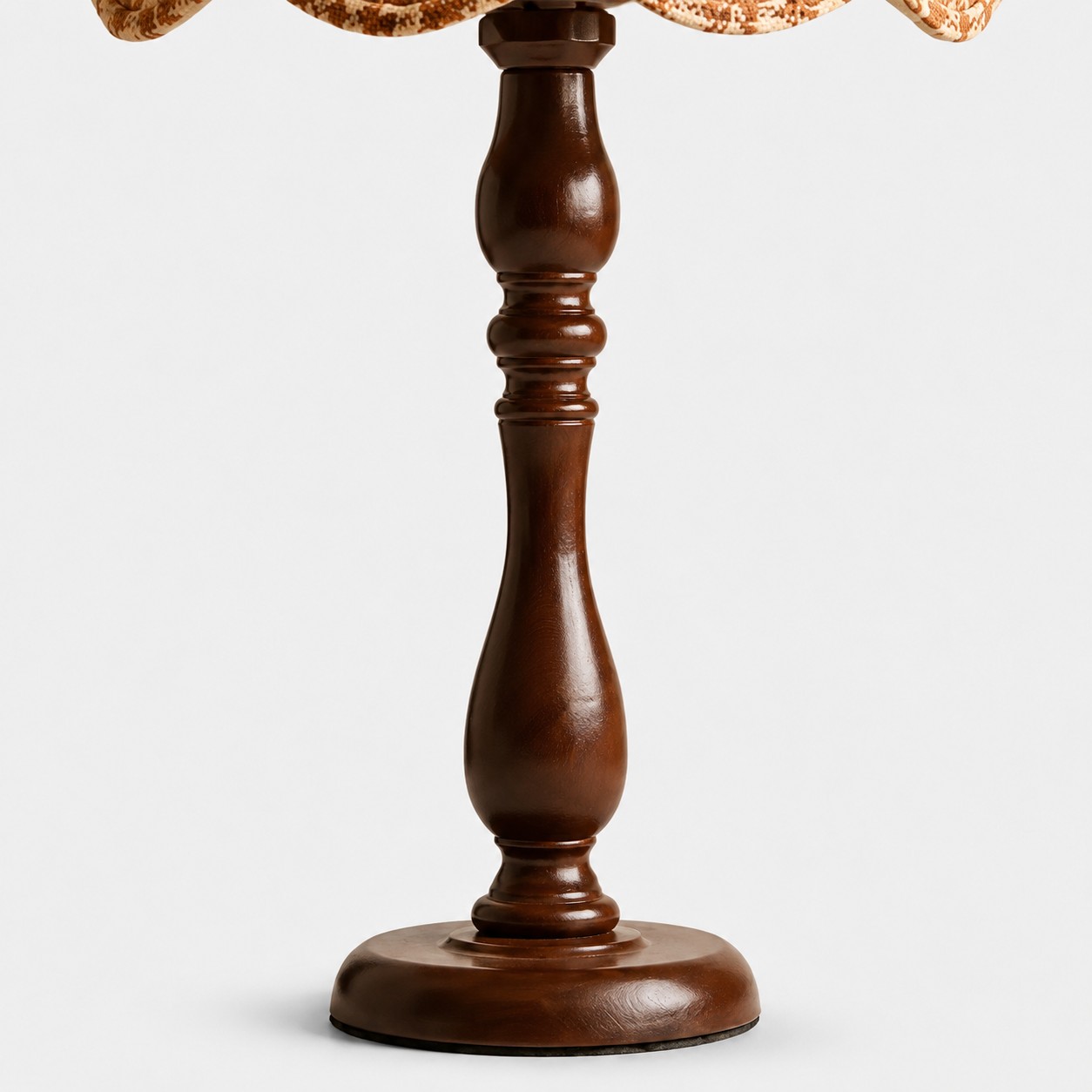 Close view of the vase-shaped wood lamp base