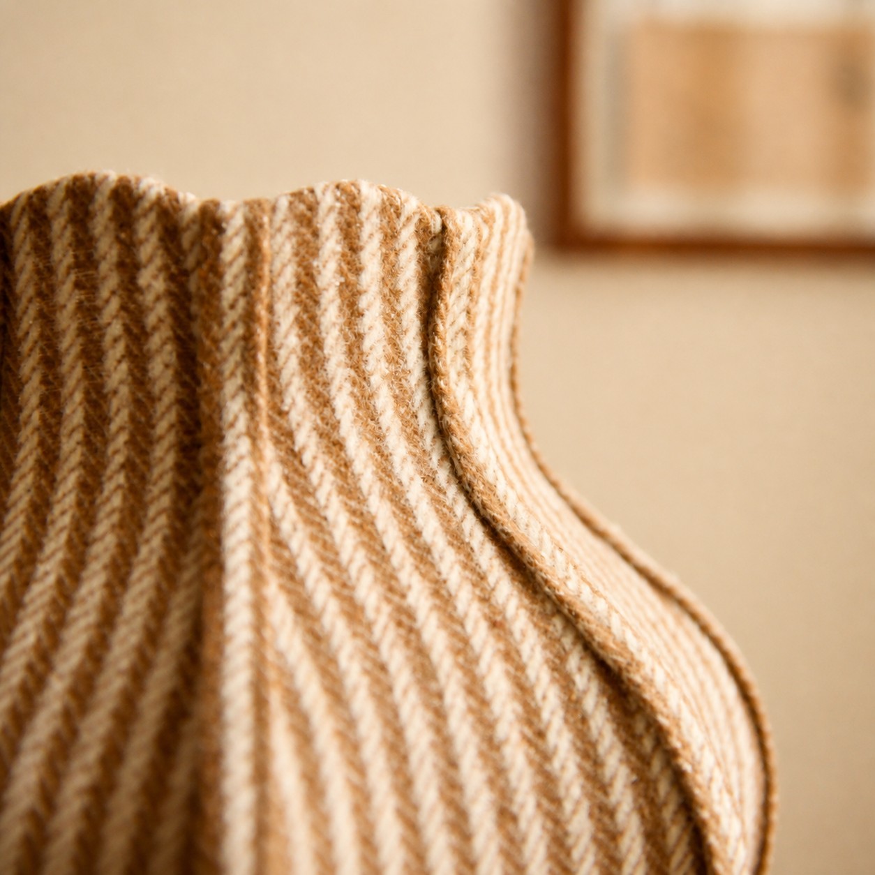 Curved fabric lampshade edge with soft woven texture