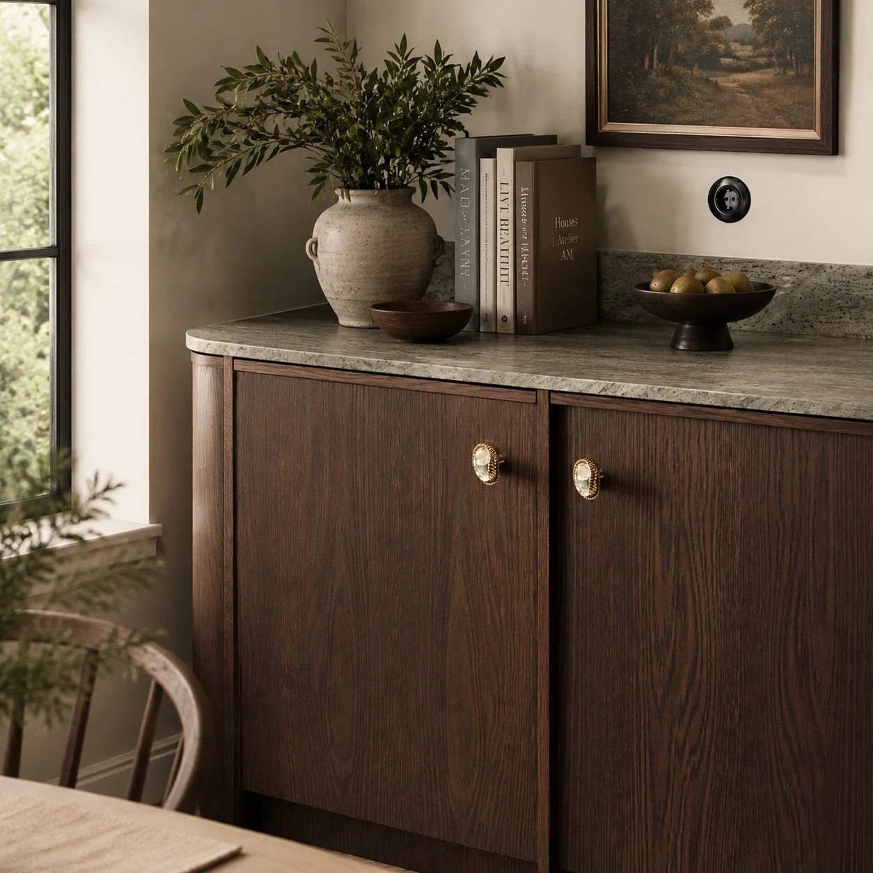 Shell brass cabinet knobs styled on dark wood furniture