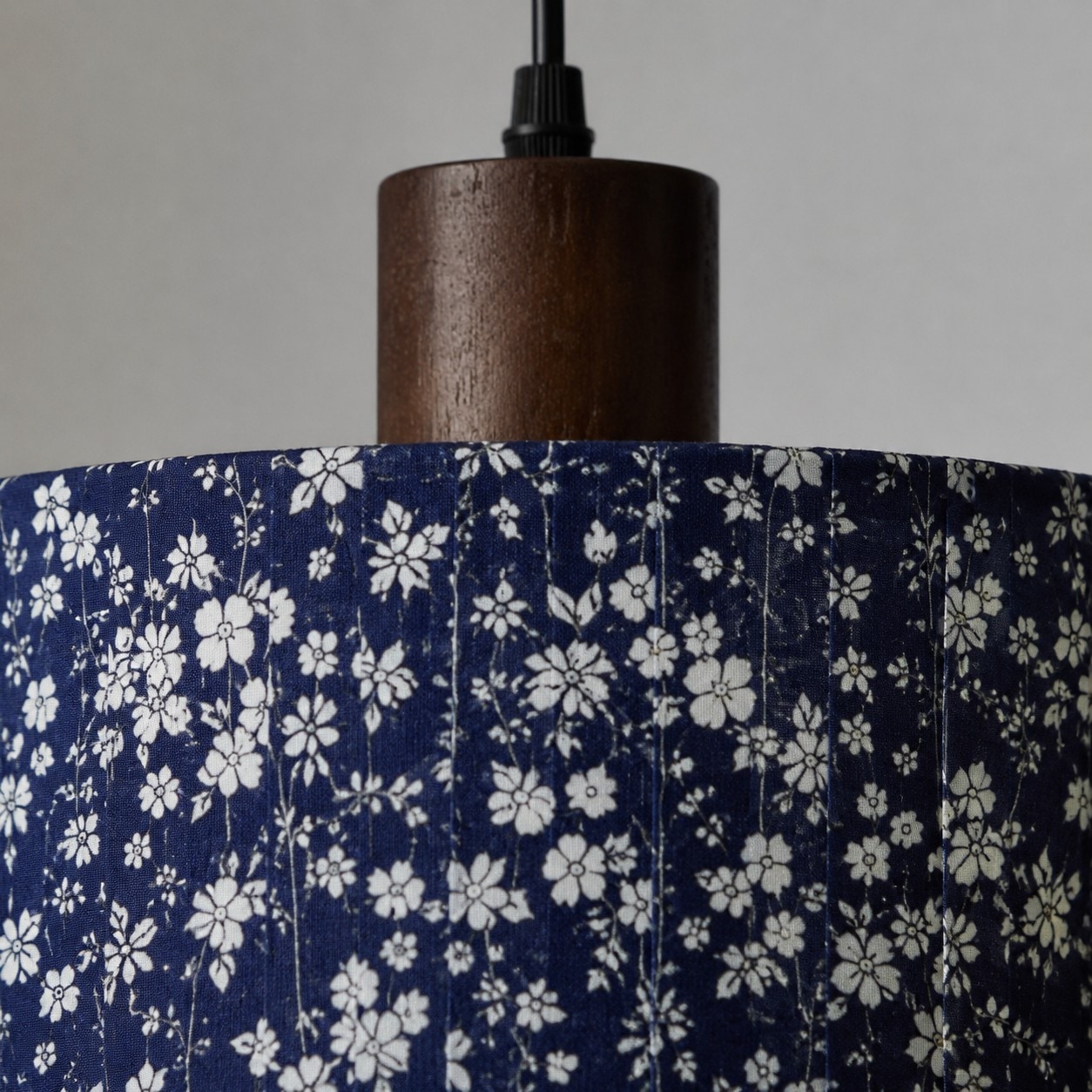 Wood-tone holder and fabric shade