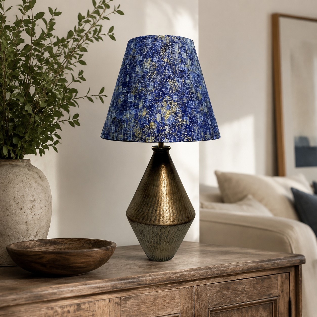 Gilt Blue fabric ceramic table lamp in a living room setting