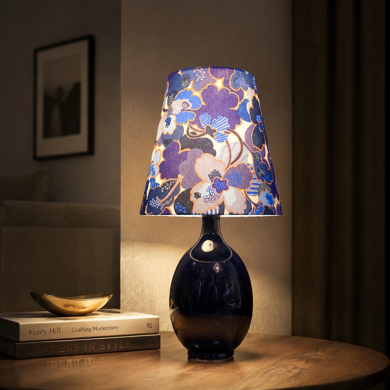 Blue floral fabric ceramic table lamp styled on a bedside table
