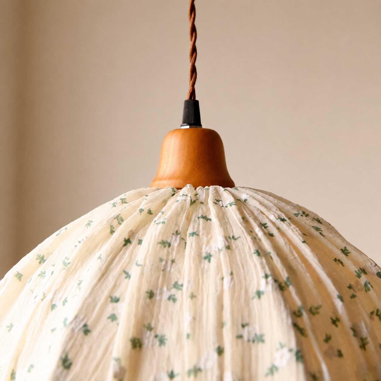 Wood-tone cap and twisted cord detail