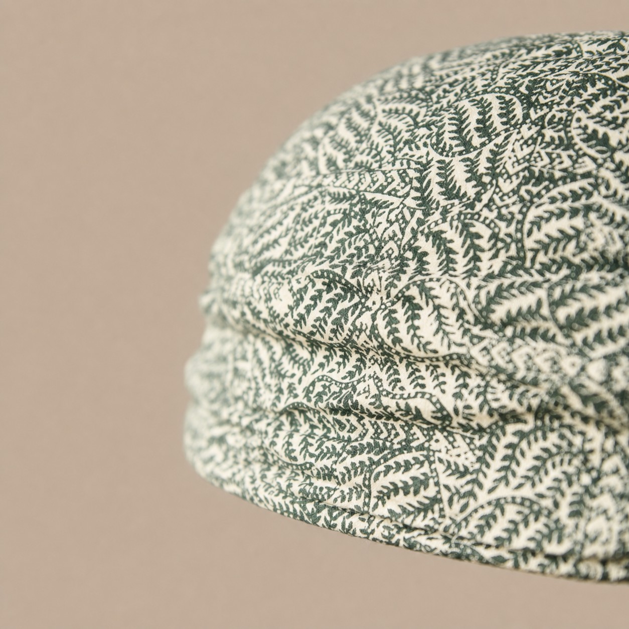 Close view of green botanical fabric shade