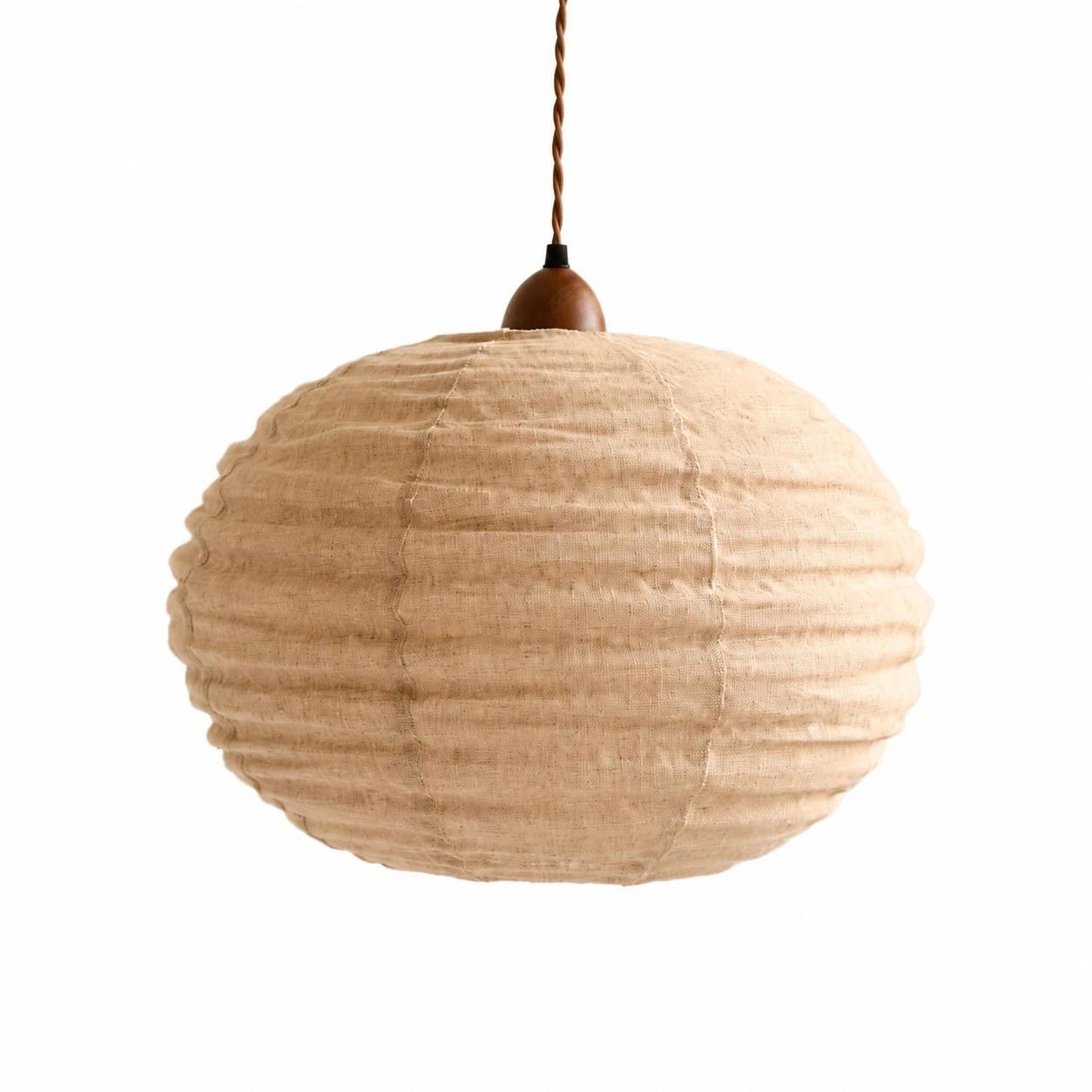 Suspension ronde en coton-lin couleur abricot sur fond blanc