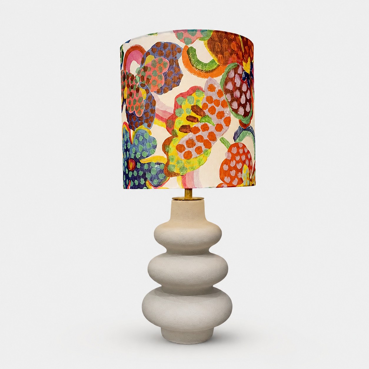Multicolor floral fabric shade table lamp with warm gray ceramic base