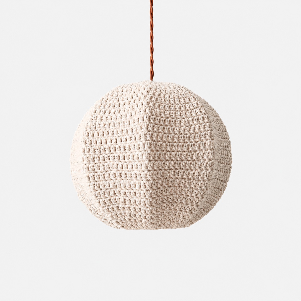 Ivory 40 cm handwoven globe pendant light shown from an angled front view