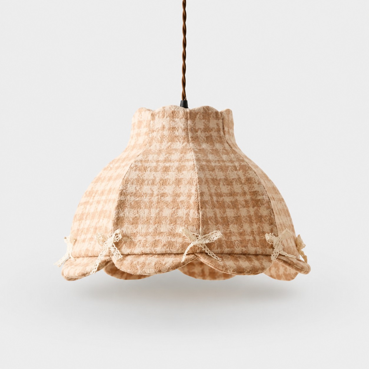 Bow accent plaid fabric pendant light on a gray background