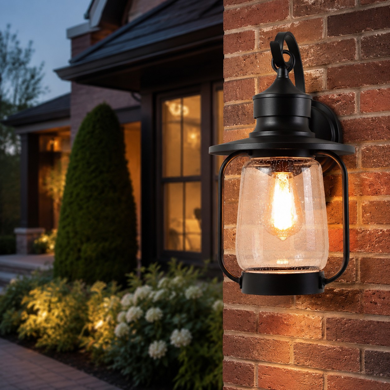 black outdoor wall lantern installed beside a garden entry