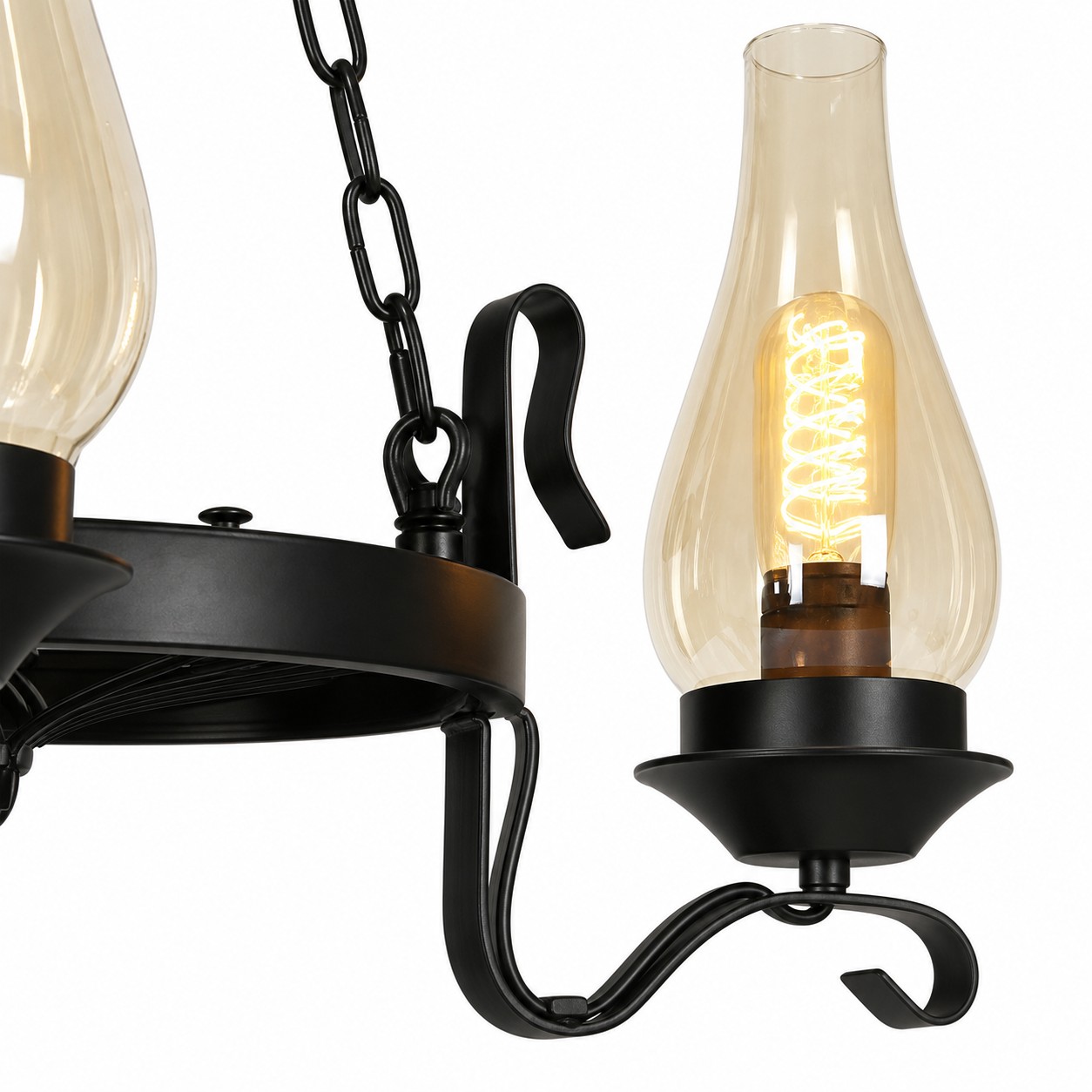 Close-up of hurricane glass shade socket holder and iron chandelier frame