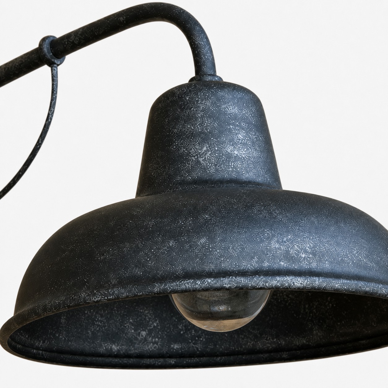 Textured antique silver finish detail on vintage metal outdoor wall sconce