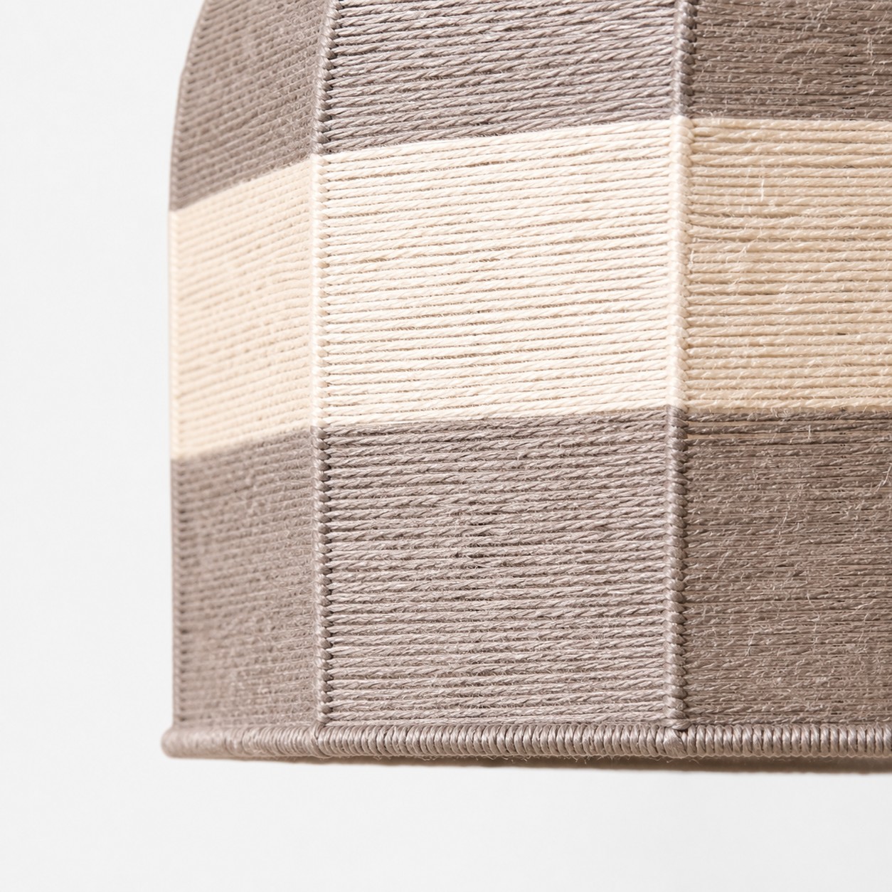 Close-up of taupe and ivory cotton thread patchwork panels