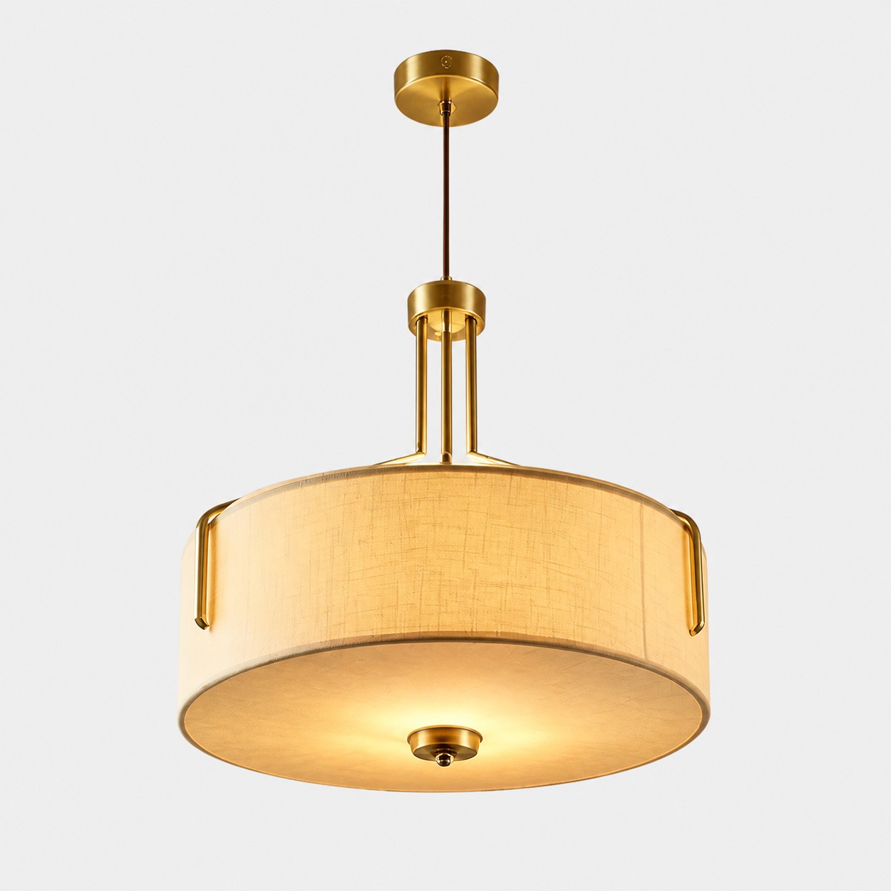 Suspension LED à abat-jour tambour en tissu avec structure métallique effet laiton