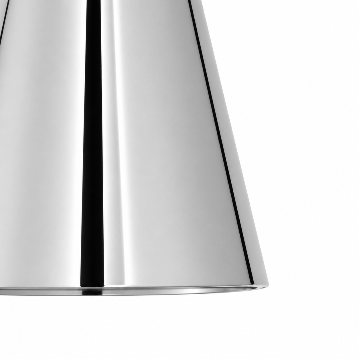 Close-up of reflective chrome finish on tapered brass shade
