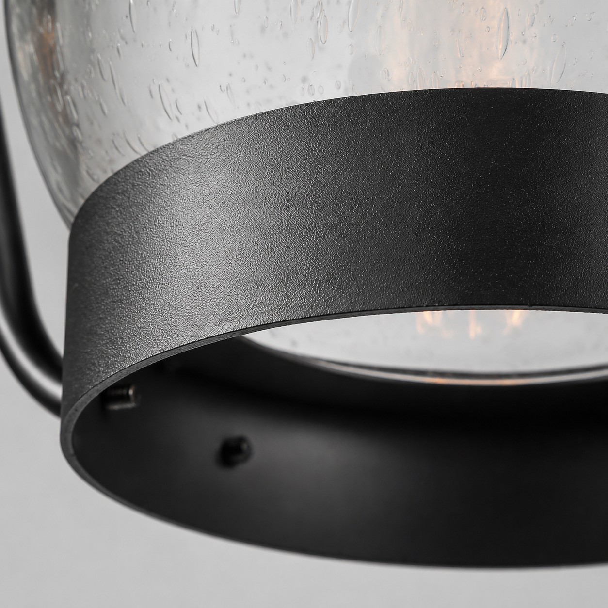 close view of rain glass shade and black metal frame