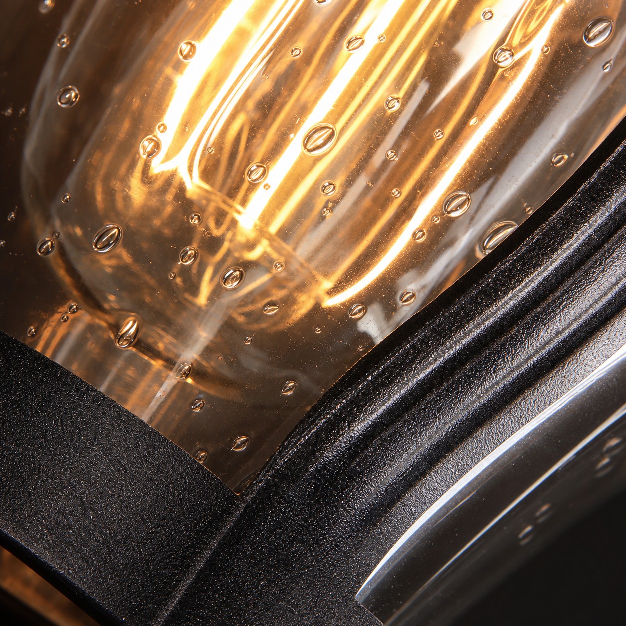 close view of curved scroll arm and metal frame