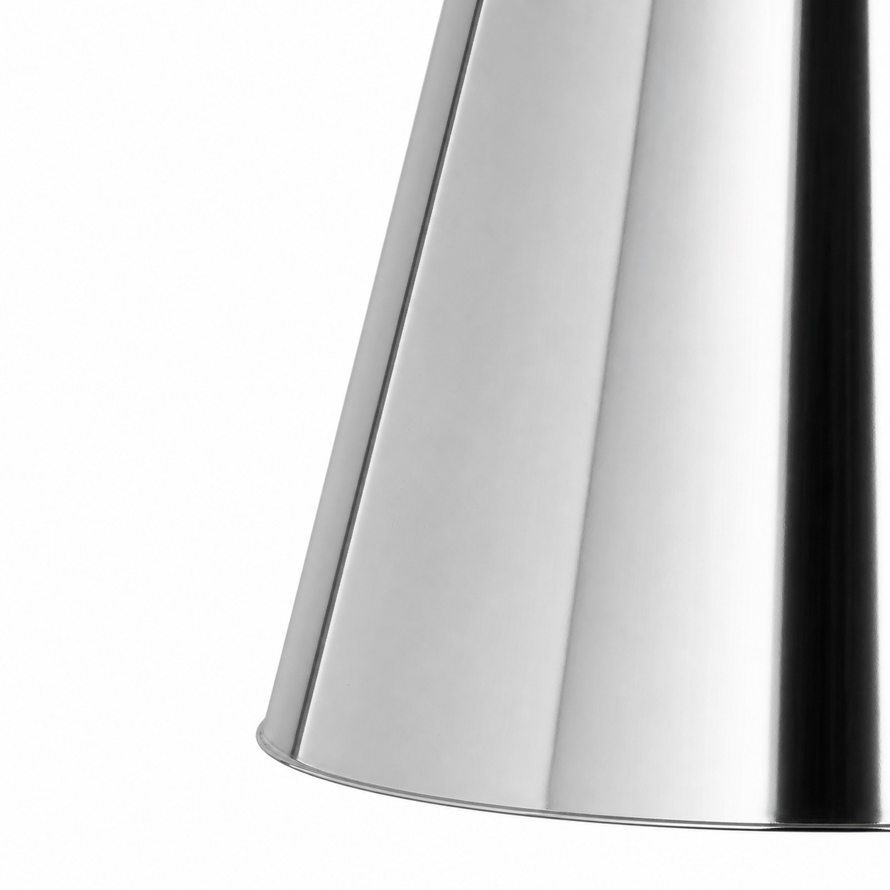 Close-up of polished chrome brass surface and rolled shade edge