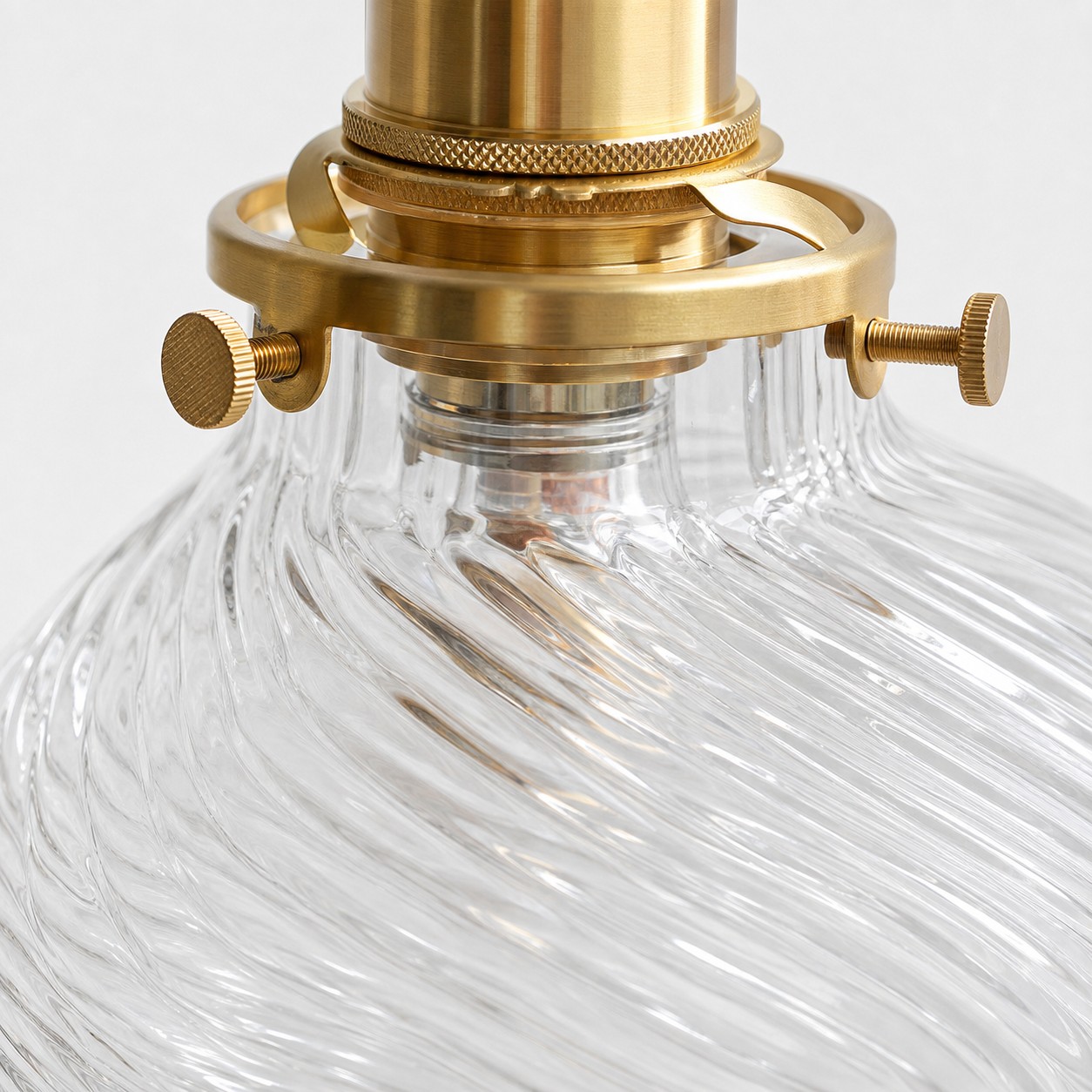 Clear glass and brass connection