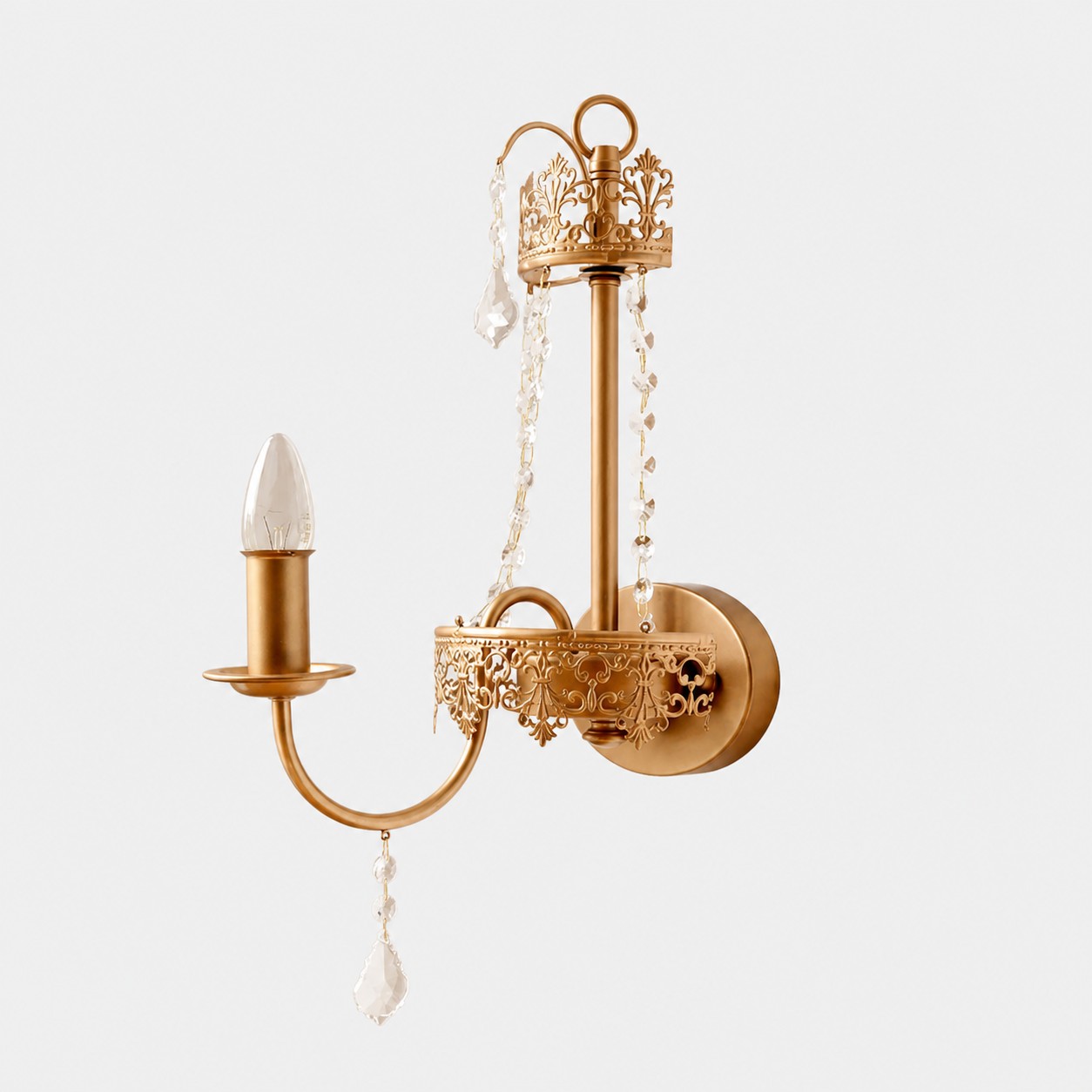 Antique brass French crystal candle wall sconce on a clean white background