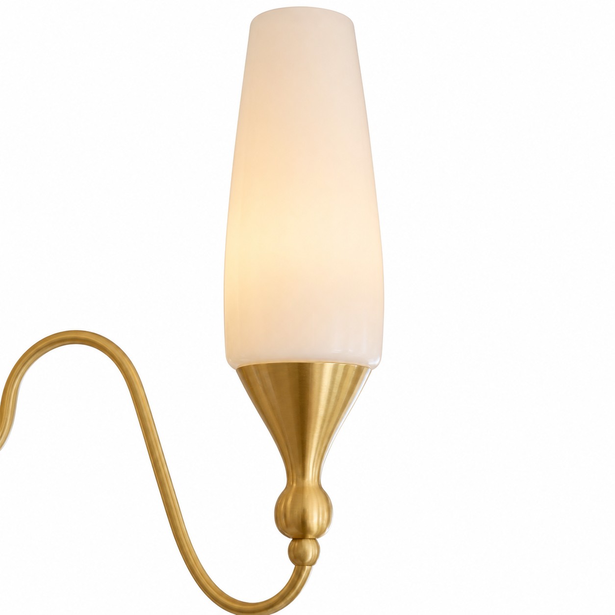 Close-up of glass shade and curved copper-tone arm