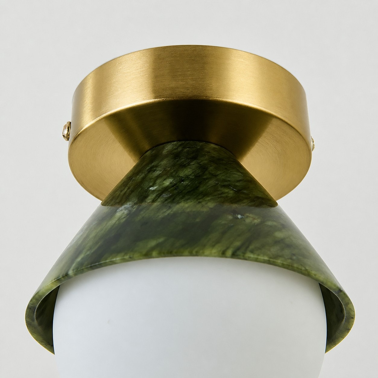 Brushed metal canopy with curved green shade