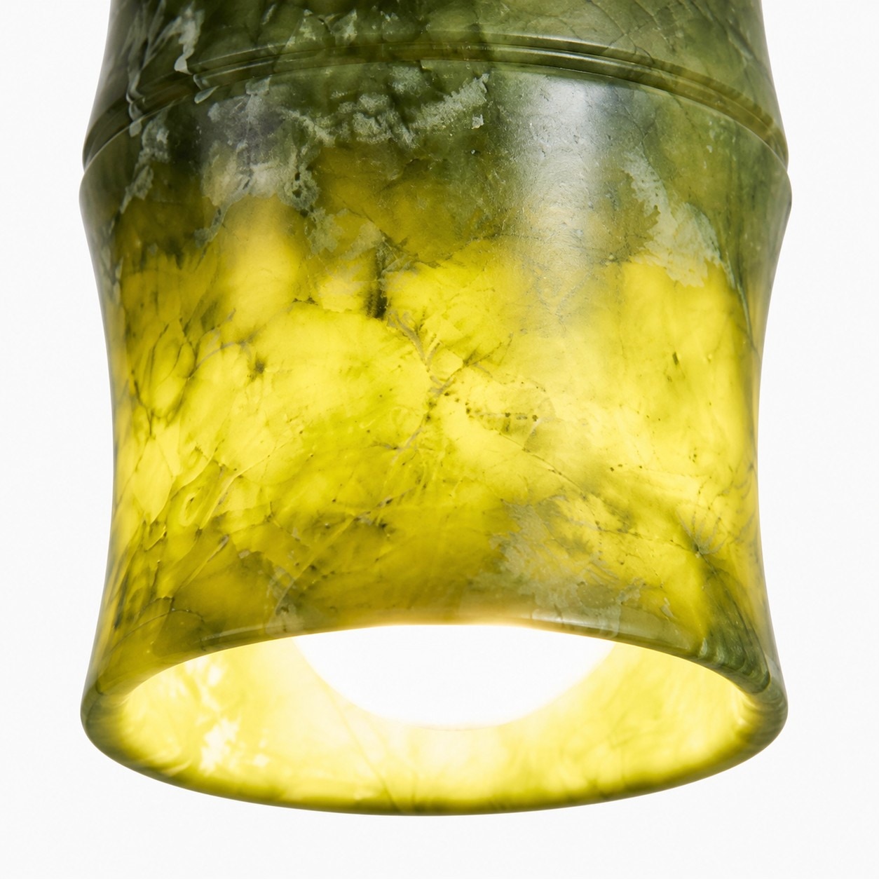 Jade shade rim and illuminated stone grain detail