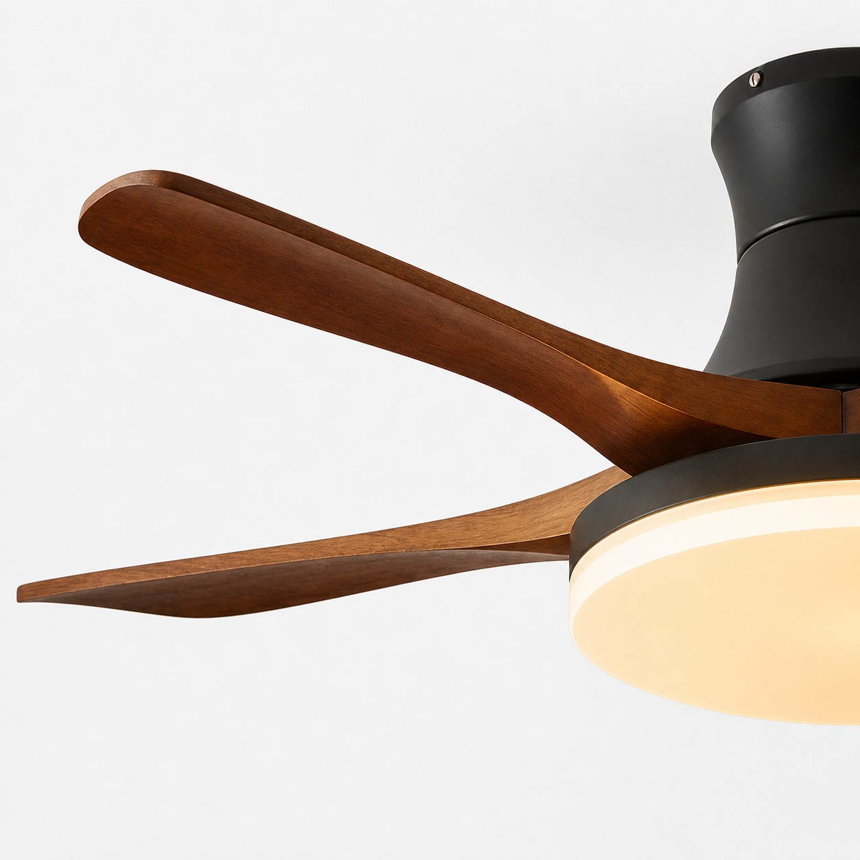 Close view of the curved wood-look blade on black walnut ceiling fan light
