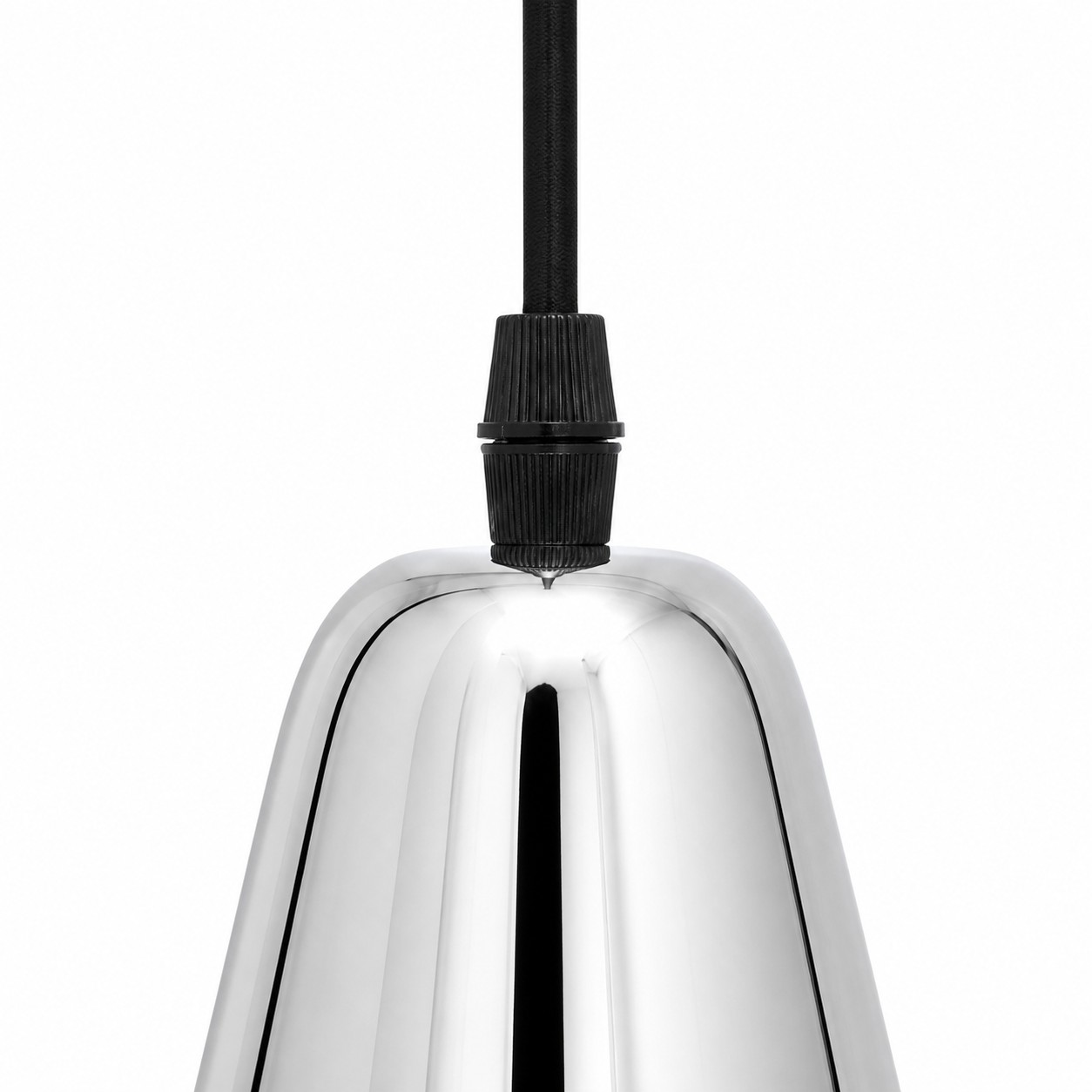 Close-up of black socket holder fitted to chrome brass pendant shade