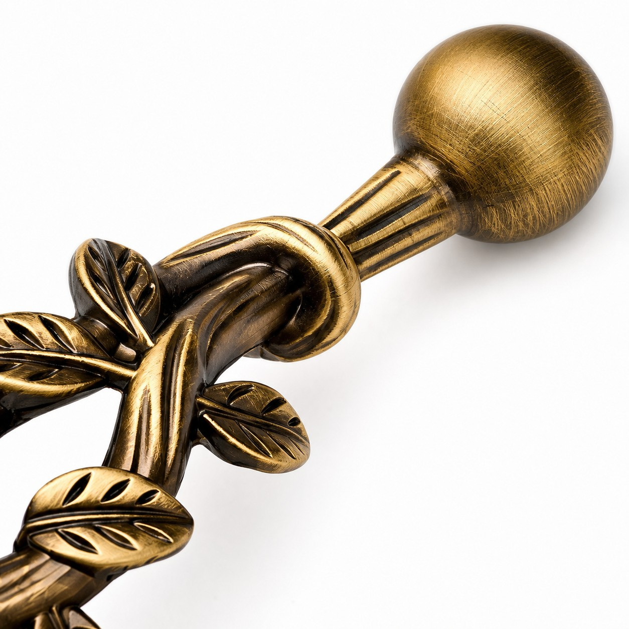 Close view of the antique brass cabinet pull end