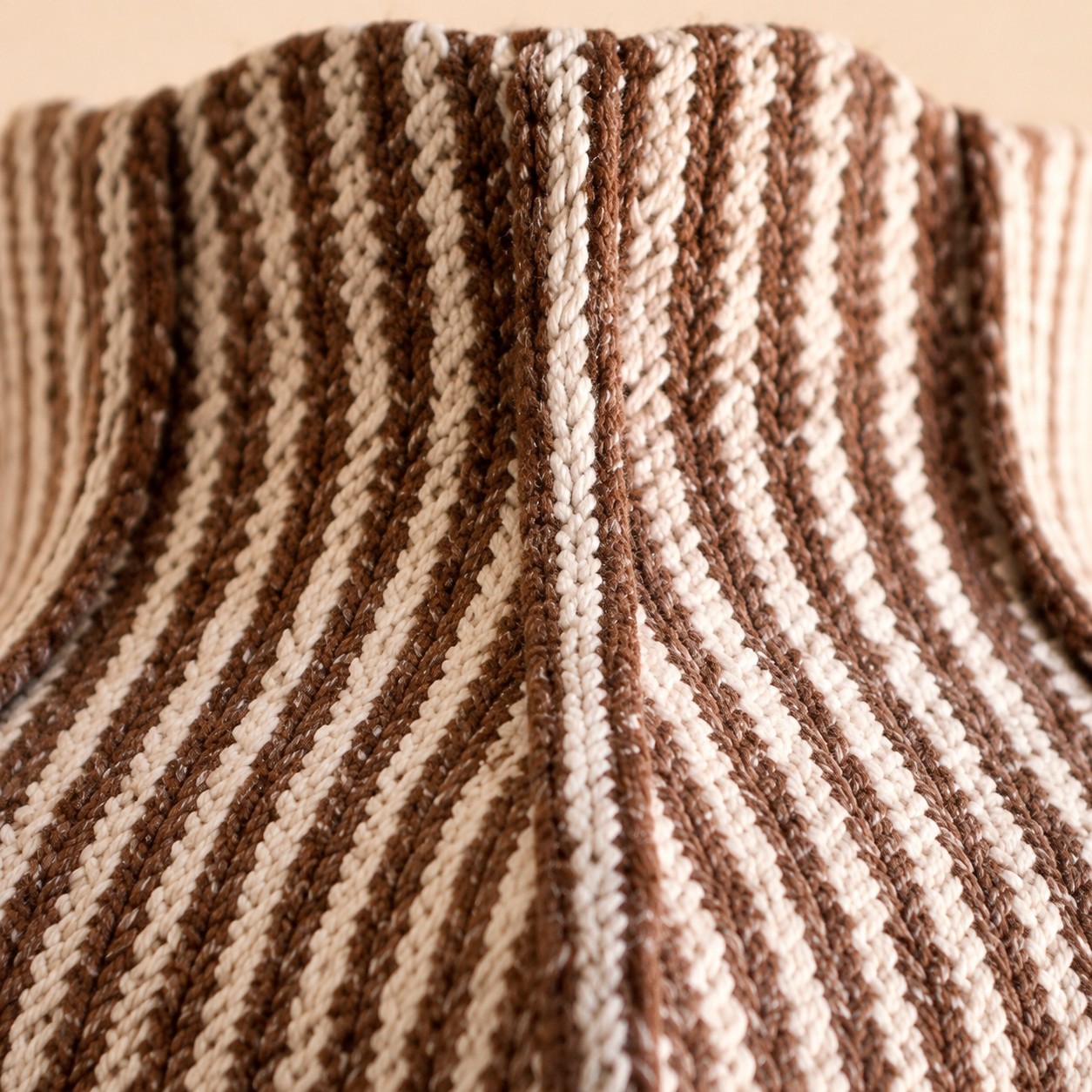 Close view of brown and cream woven striped fabric texture