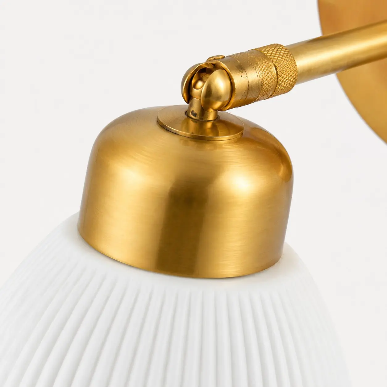 Adjustable brass joint and ceramic shade detail