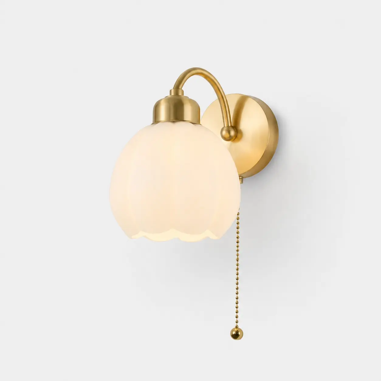 Wandleuchte aus Messing mit Zugkette